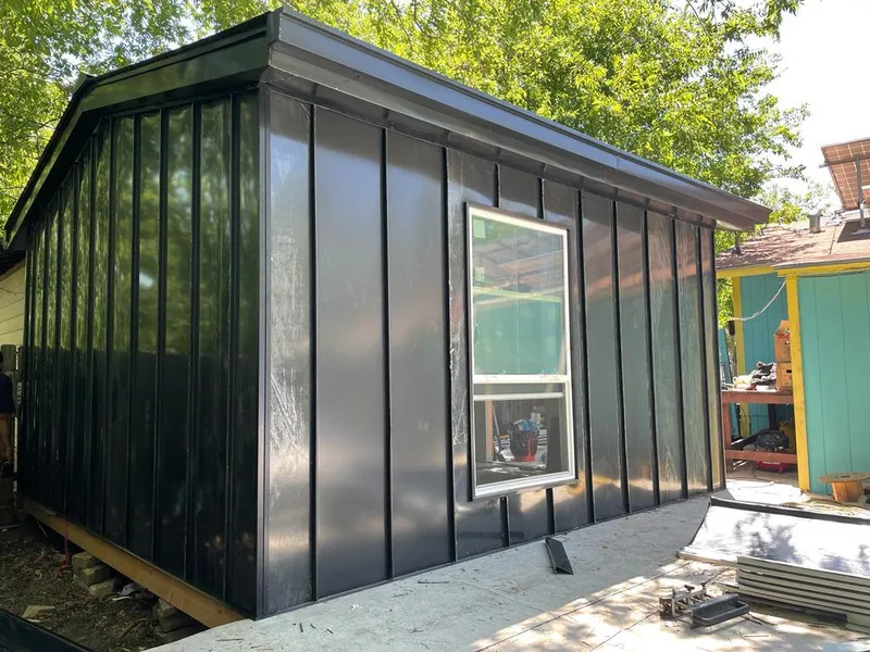 Black standing seam metal wall panels for Roof Inspection in East Niles