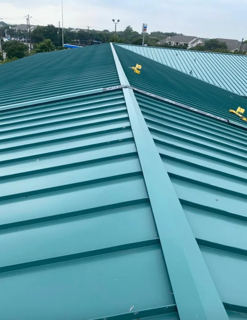 Green commercial metal roof ridge and valley for Metal Roof Repair in East Niles