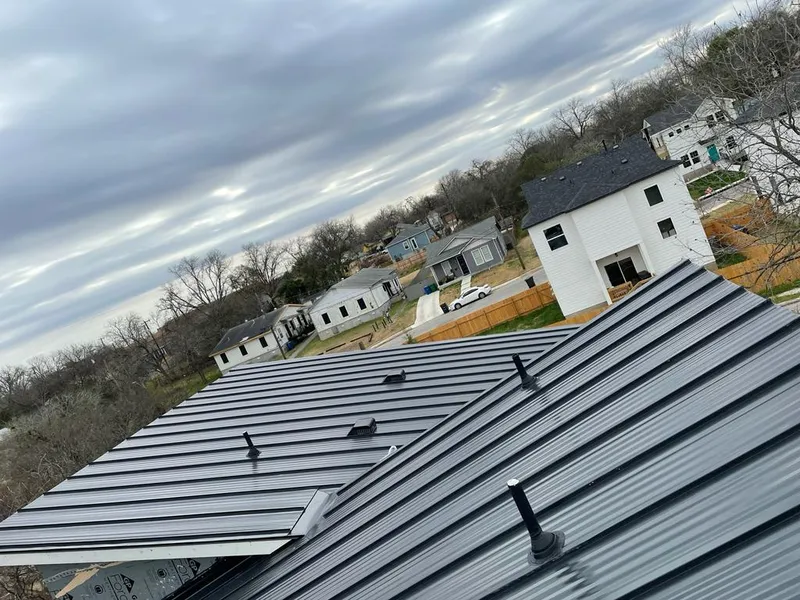 Standing seam metal roof panels with vents for Skylight Repair in East Niles